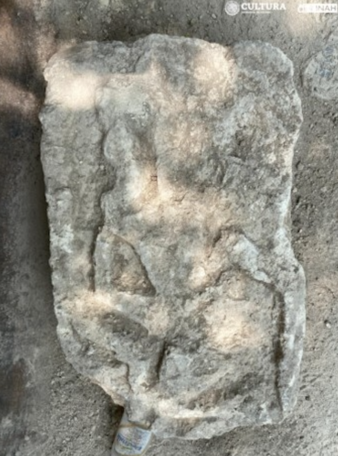 Some burials had tombstones, one of which showed a male figure in a skirt.