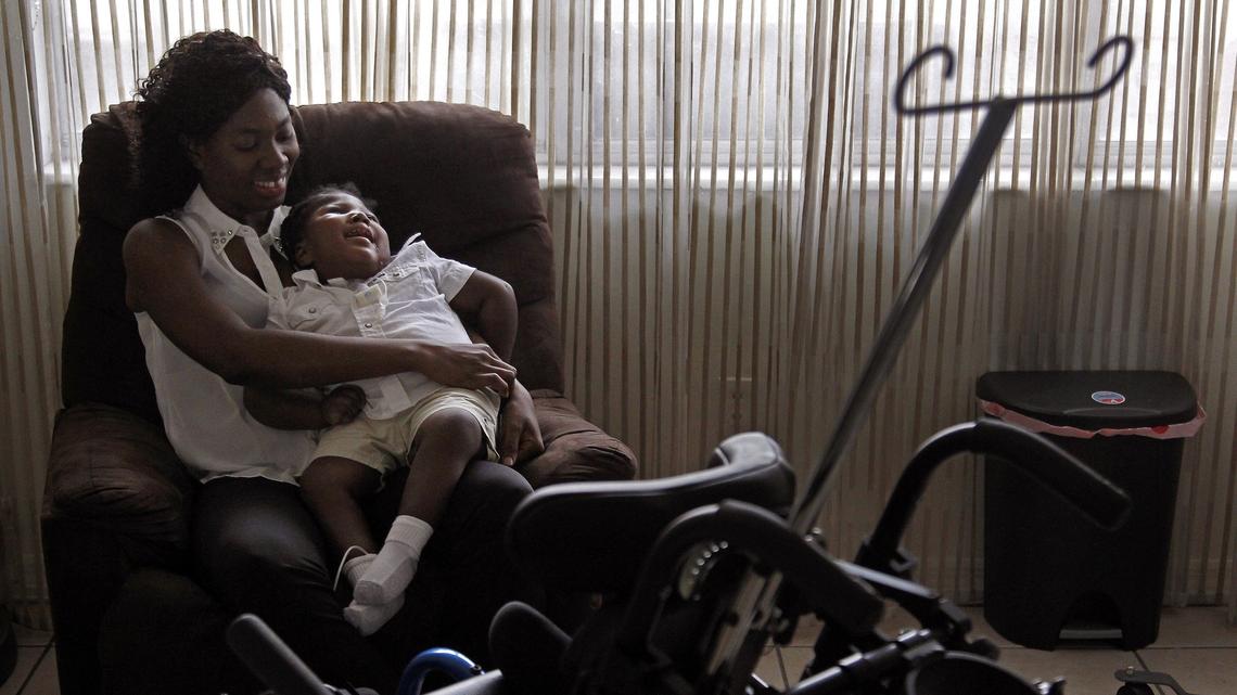 Wish Book 2017 told the story of young Samuel Augustine who “arrived as a one-pound bundle of uncertainty.” Born prematurely, Samuel couldn’t breathe, eat or cry due to microcephaly, a rare neurological condition in which an infant’s head is significantly smaller than the heads of other children.  Antoinise Augustin, 35, sits with Samuel in her newly decorated apartment on Nov. 21, 2018, after being given donations totaling $33,000 that helped the family in ways that far outstripped their simple request to obtain a suitable wheelchair.