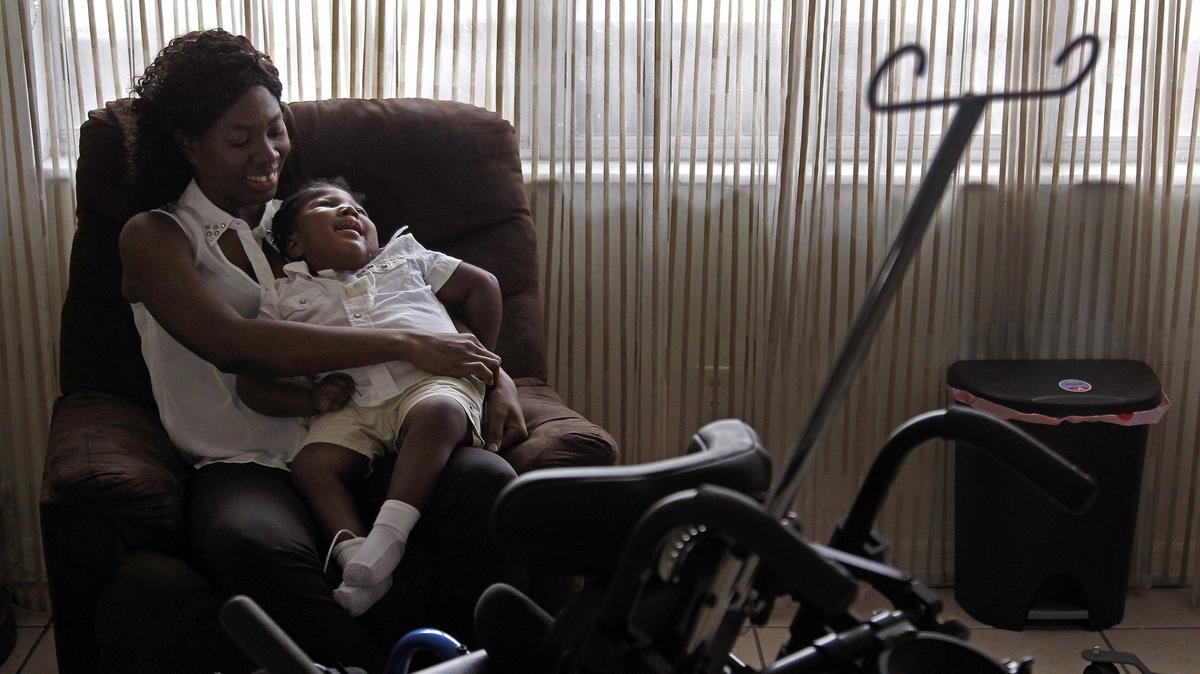 Wish Book 2017 told the story of young Samuel Augustine who “arrived as a one-pound bundle of uncertainty.” Born prematurely, Samuel couldn’t breathe, eat or cry due to microcephaly, a rare neurological condition in which an infant’s head is significantly smaller than the heads of other children.  Antoinise Augustin, 35, sits with Samuel in her newly decorated apartment on Nov. 21, 2018, after being given donations totaling $33,000 that helped the family in ways that far outstripped their simple request to obtain a suitable wheelchair.