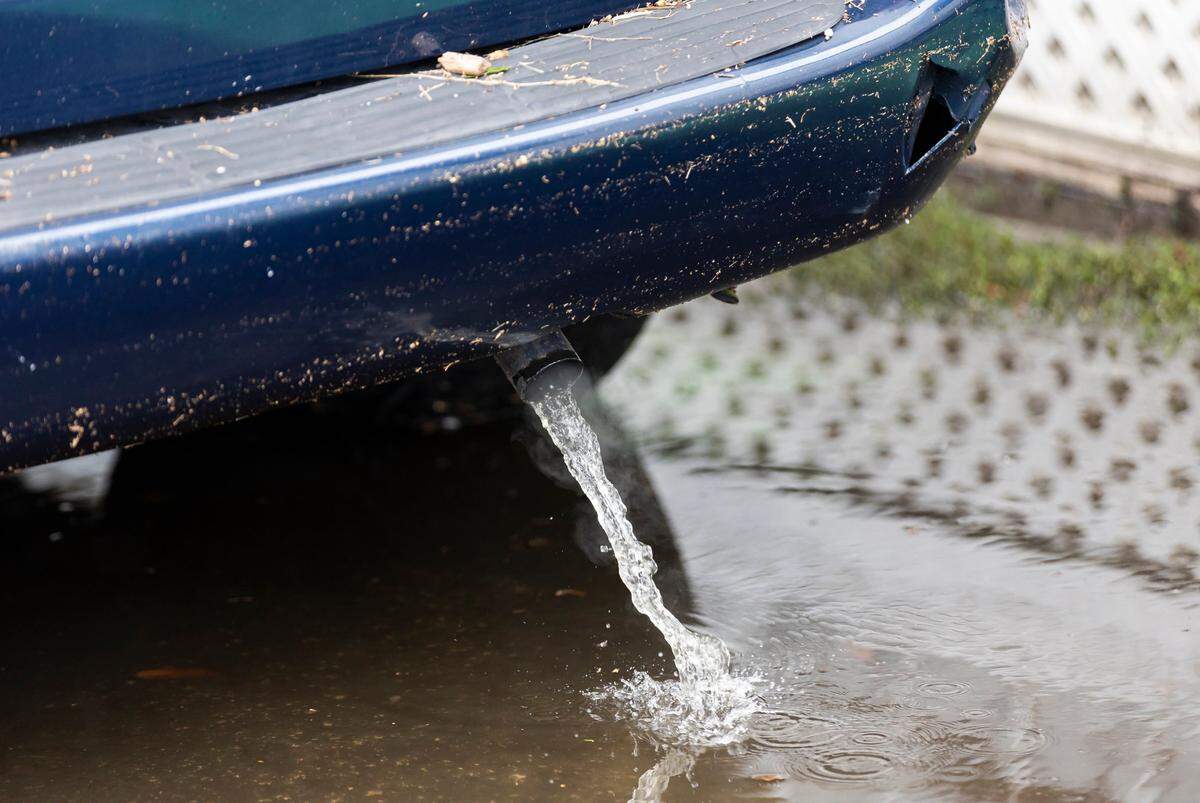 Water leaks from a blue minivan after floodwaters inundated the vehicle, which was parked at Royal Palm Mobile Home Park on Thursday, June 13, 2024, in Hallandale Beach, Florida. Residents at the mobile home park are dealing with the aftermath of Wednesday’s storm that left their community flooded.