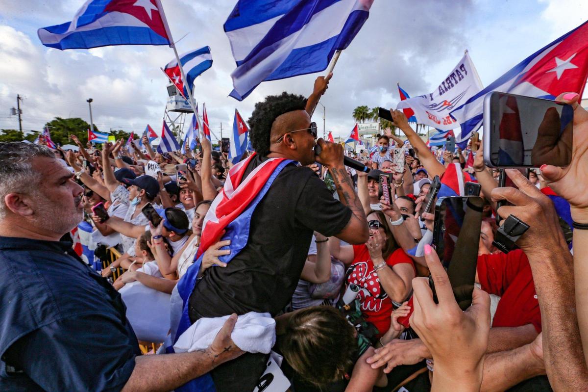 Gente de Zona performs on Calle Ocho near Versailles Restaurant in Miami on Wednesday, July 14, 2021.