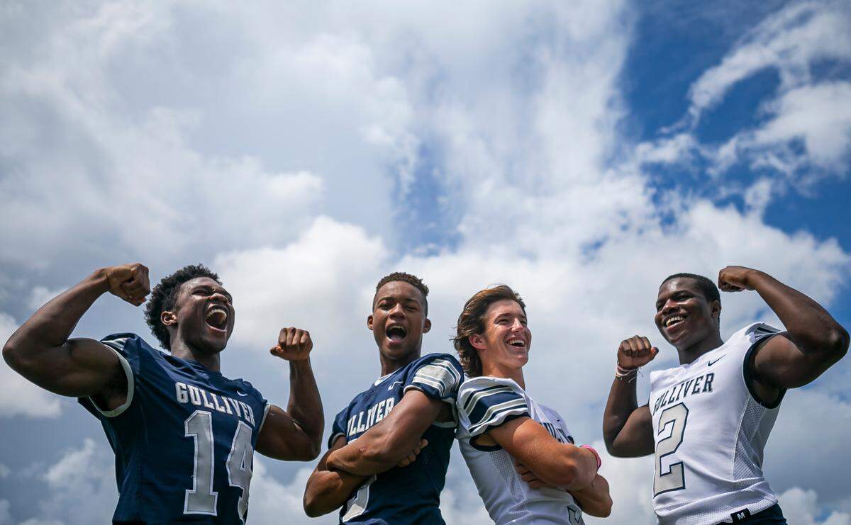 From left to right: Gulliver Prep running back Sedrick Irvin Jr., wide receiver Jalen Brown, quarterback Carson Haggard and athlete Travious Lathan are photographed before the start of a preseason practice at their school’s football field in Pinecrest, Florida on Monday, August 9, 2021.