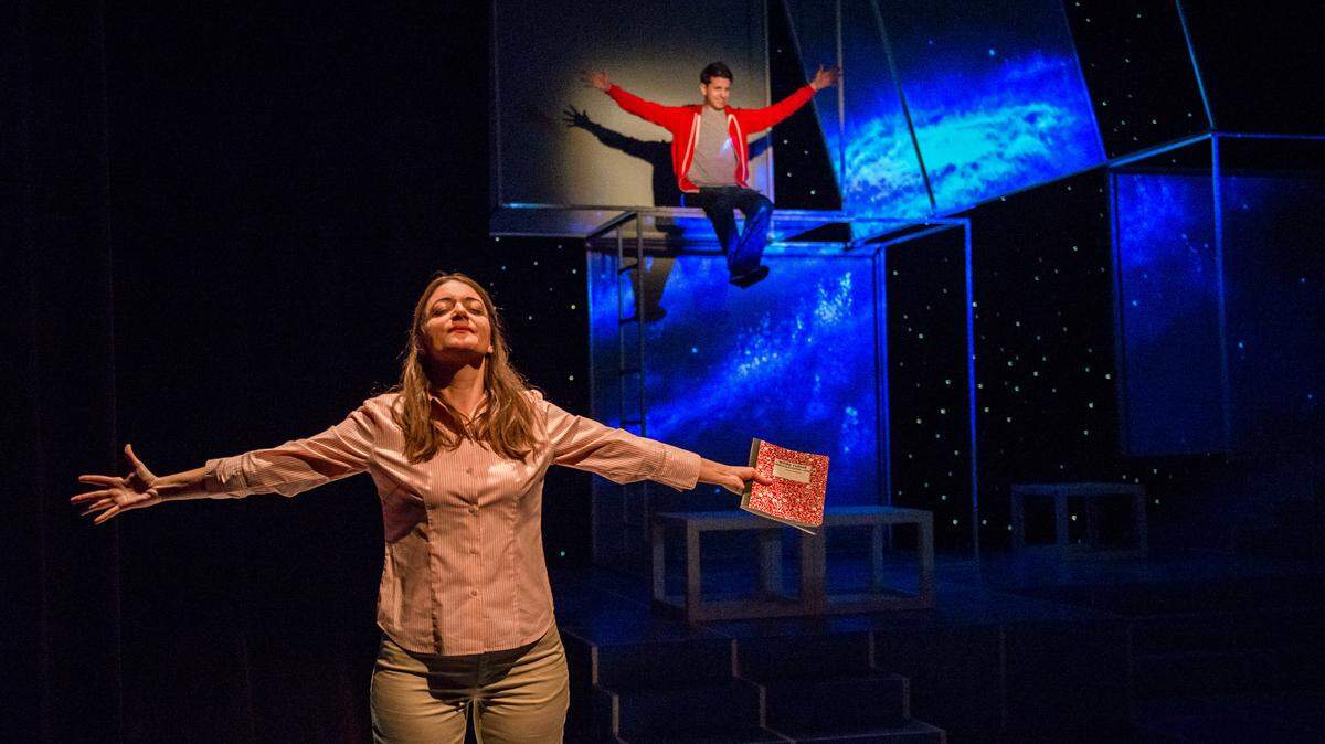 Gretchen Porro as the teacher Siobhan reads from the imaginative work of Ryan Didato’s Christopher in Zoetic Stage’s ‘The Curious Incident of the Dog in the Night-Time.’