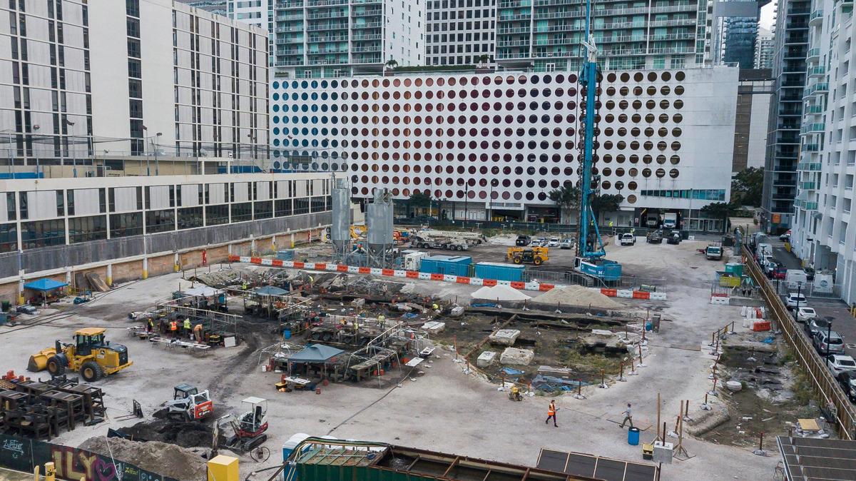 An overhead view shows the site of a major archaeological excavation on the Miami River slated for high-rise development in Miami’s Brickell district. Archaeological teams have dug to the natural limestone bedrock where postholes marking the foundation of structures in a 2,500-year-old Tequesta town have been uncovered. Hundreds of thousands of artifacts, animal and human remains and other evidence of indigenous occupation going back as far as 7,000 years have been found.