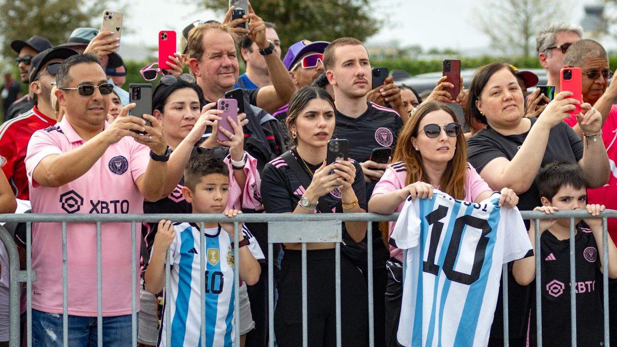 Fans take pictures of the Inter Miami players coming down the bus before the start of the MLS match against Orlando City at Chase Stadium on Saturday, March 2, 2024, in Fort Lauderdale, Fla.