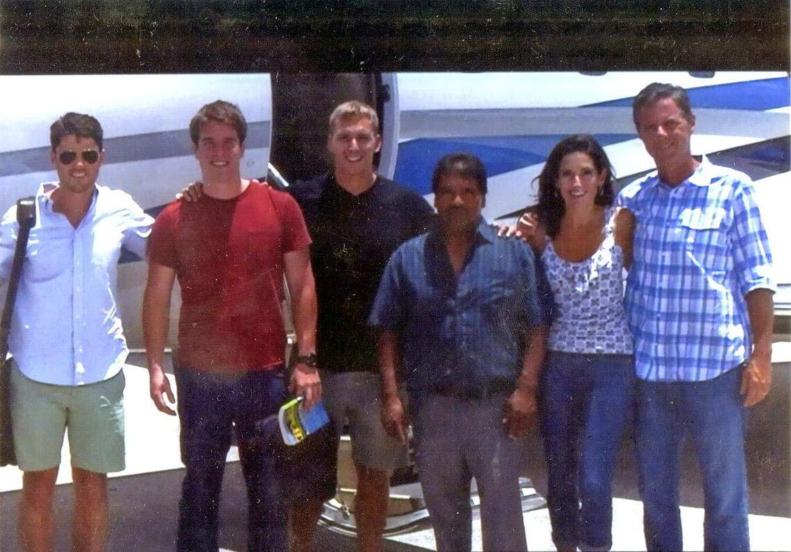Group photo shows Jerry Falwell Jr. and his wife, Rebecca, at the right, and Giancarlo Granda, in the red shirt. Next to him in the white shirt is Jerry Falwell III, also known as Trey.