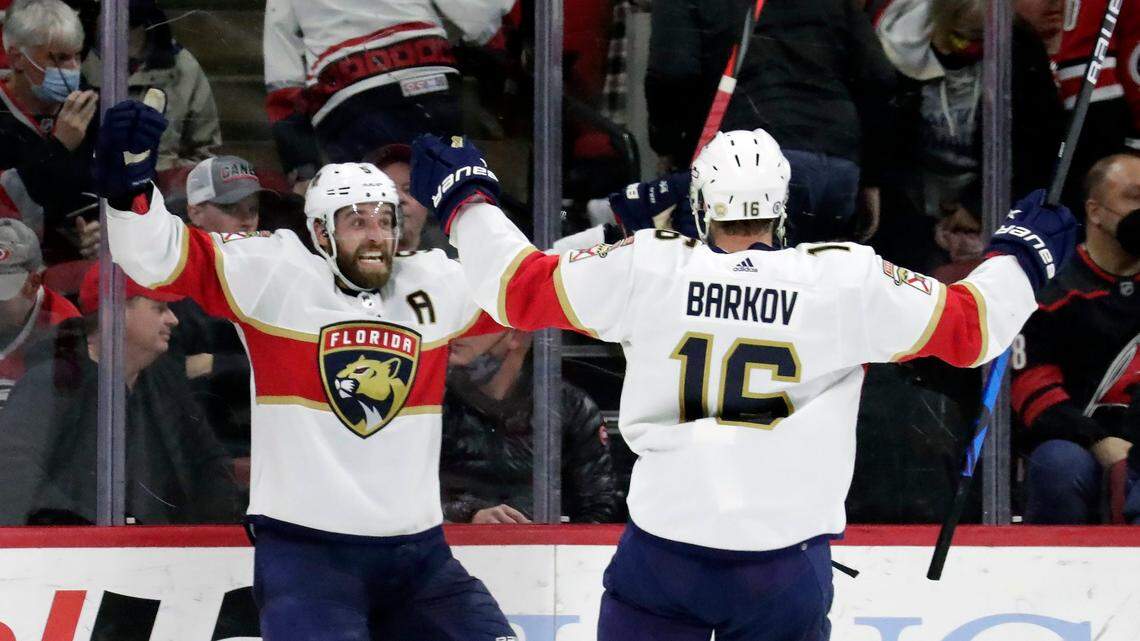 Florida Panthers defenseman Aaron Ekblad, left, celebrates his game winning goal with center Aleksander Barkov (16) during the overtime period of an NHL hockey game against the Carolina Hurricanes, Wednesday, Feb. 16, 2022, in Raleigh, N.C. (AP Photo/Chris Seward)