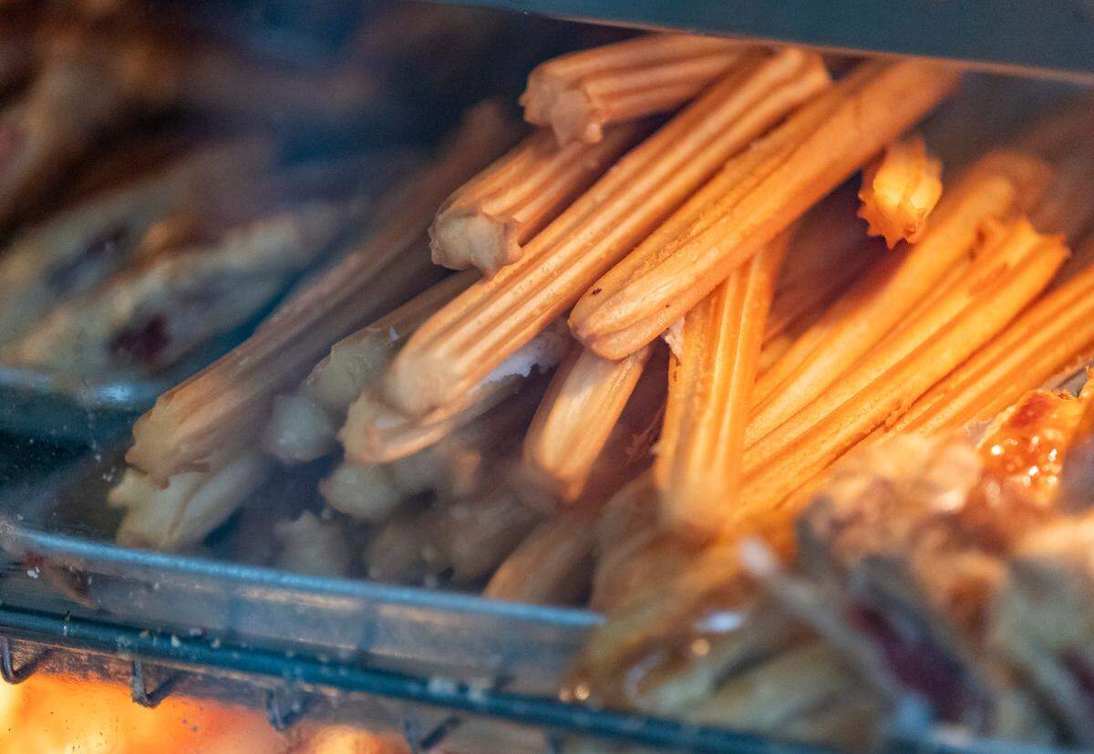 Churros are on sale at Versailles Restaurant Cuban Cuisine as temperatures dip into the mid 40s across South Florida on Friday, Jan. 24, in Miami, Fla.