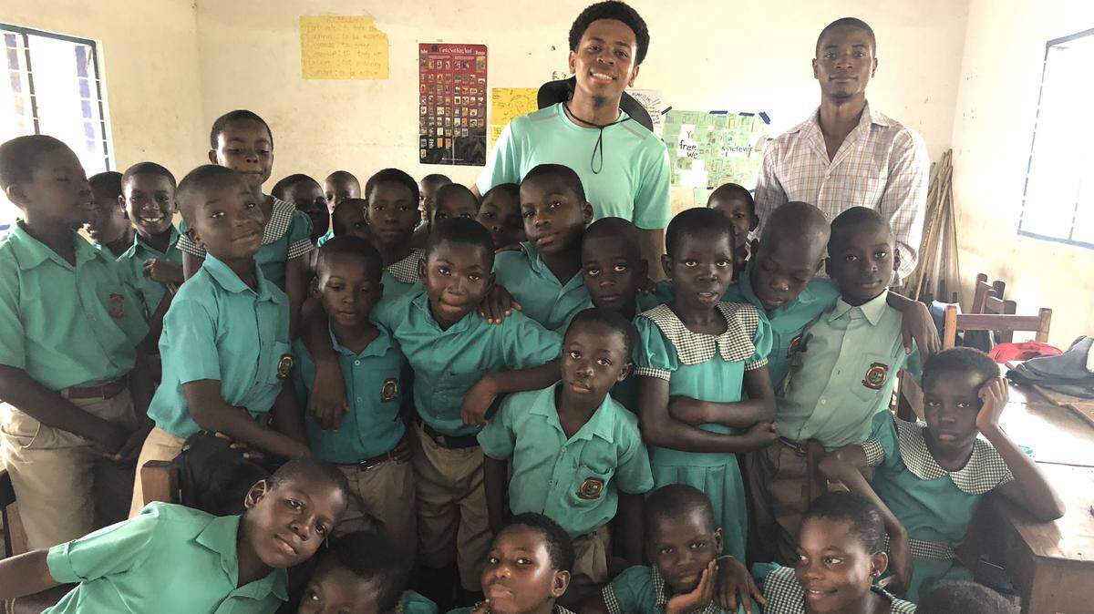 David Barbier, center back, of Monsignor Edward Pace High School with a group of students during his trip to Ghana with the Nyah Project Fellowship.