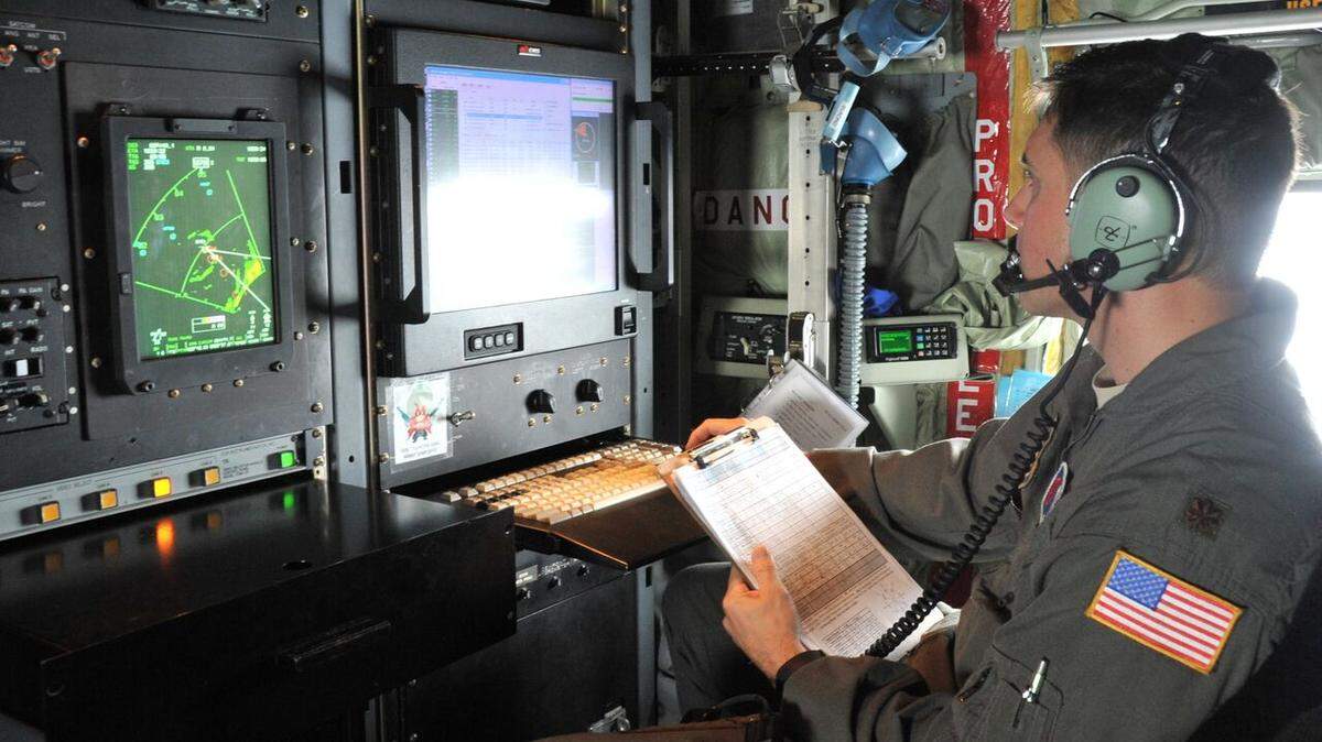 Maj. Jeremy DeHart, a 53rd Weather Reconnaissance Squadron aerial reconnaissance weather officer, reviews data from Hurricane Michael.