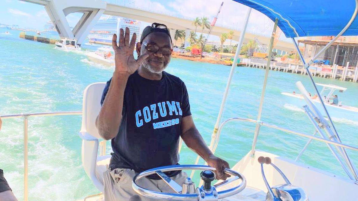 Renel Noel aboard his 42-foot 1972 Hatteras fishing boat.