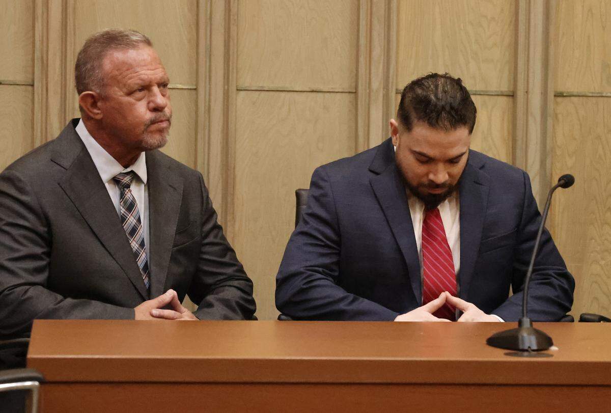 Former Miami-Dade police officer Daniel Ramos-Aviles, right, sits with his attorney, Scott Kotler, during his trial at the Richard E. Gerstein Justice Building in Miami, Florida, on Thursday, Sept. 4, 2025. Ramos-Aviles was found guilty of molesting three young girls over a 10-year period in a case presided over by Judge Marisa Tinkler Mendez in Courtroom 4-6.