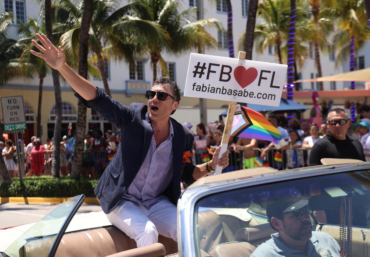 Fabian Basabe waves to an angry crowd during the Miami Beach pride parade on April 16, 2023.