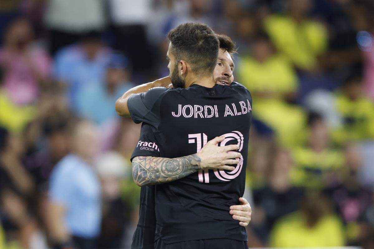 Lionel Messi #10 of Inter Miami CF celebrates after scoring the team's fourth goal with teammate Jordi Alba #18 during the MLS match between Nashville SC and Inter Miami CF at GEODIS Park on October 18, 2025 in Nashville, Tennessee. 
