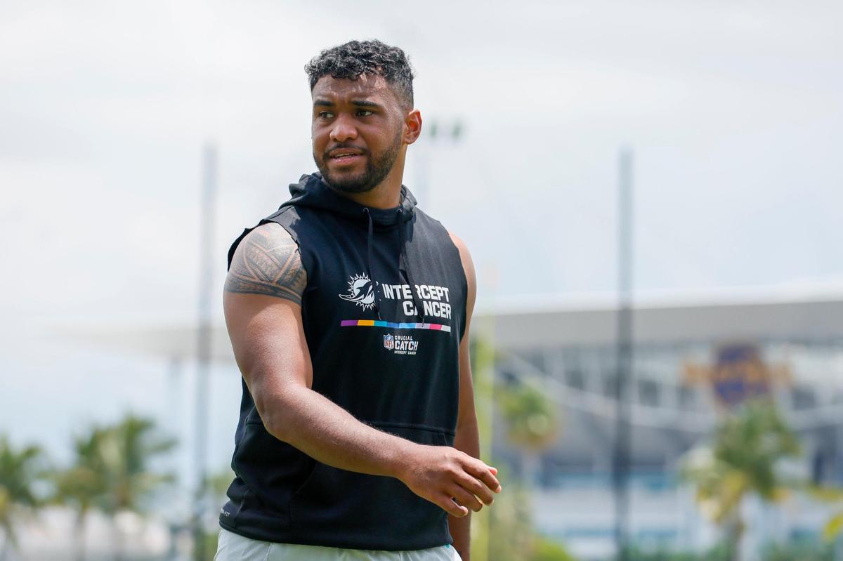 Miami Dolphins quarterback Tua Tagovailoa (1) looks on after working out during mandatory minicamp at the Baptist Health Training Complex in Miami Gardens, Florida on Wednesday, June 7, 2023.