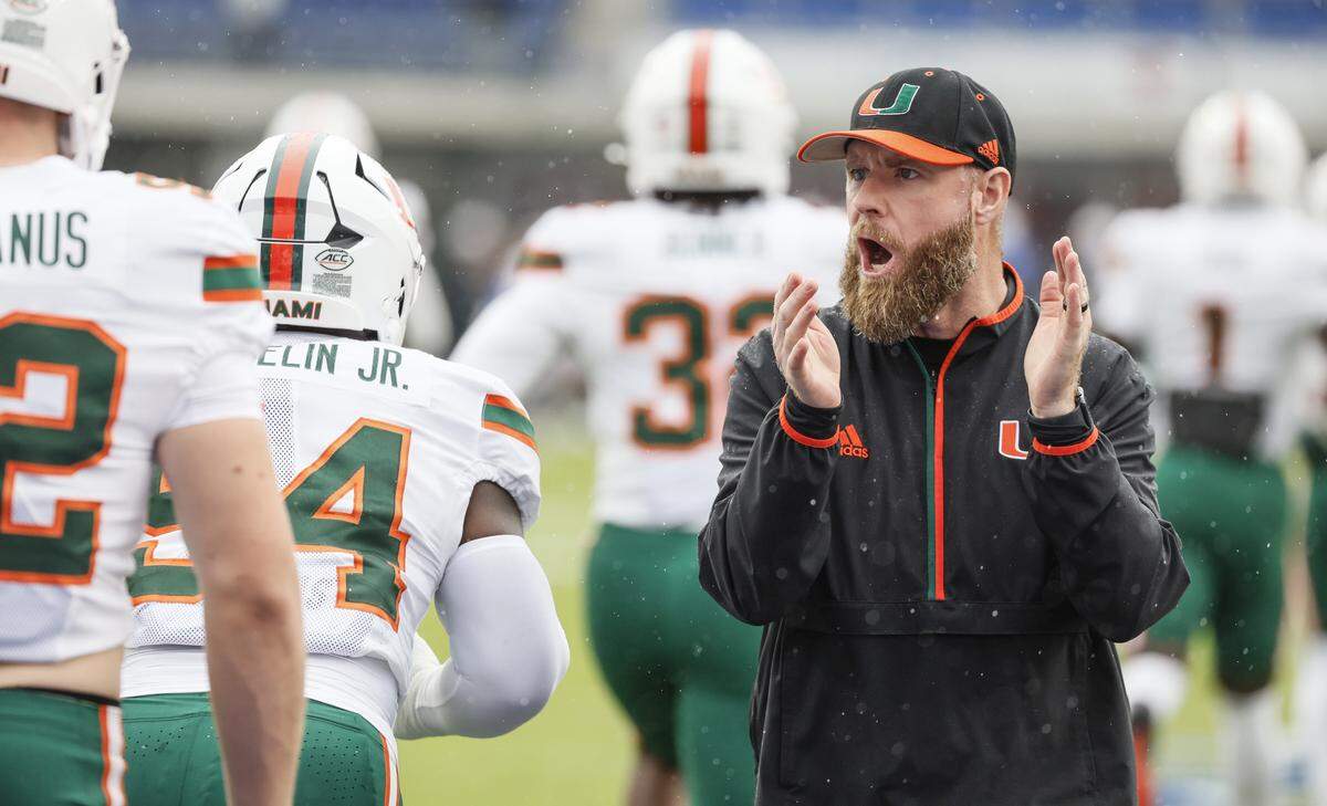 Miami Hurricanes Defensive Coordinator / Linebackers Coach Corey Hetherman works with players before the start of an NCAA football game against Southern Methodist University Mustangs at Gerald Ford Stadium on Saturday, November 1, 2025, in Dallas, Texas.