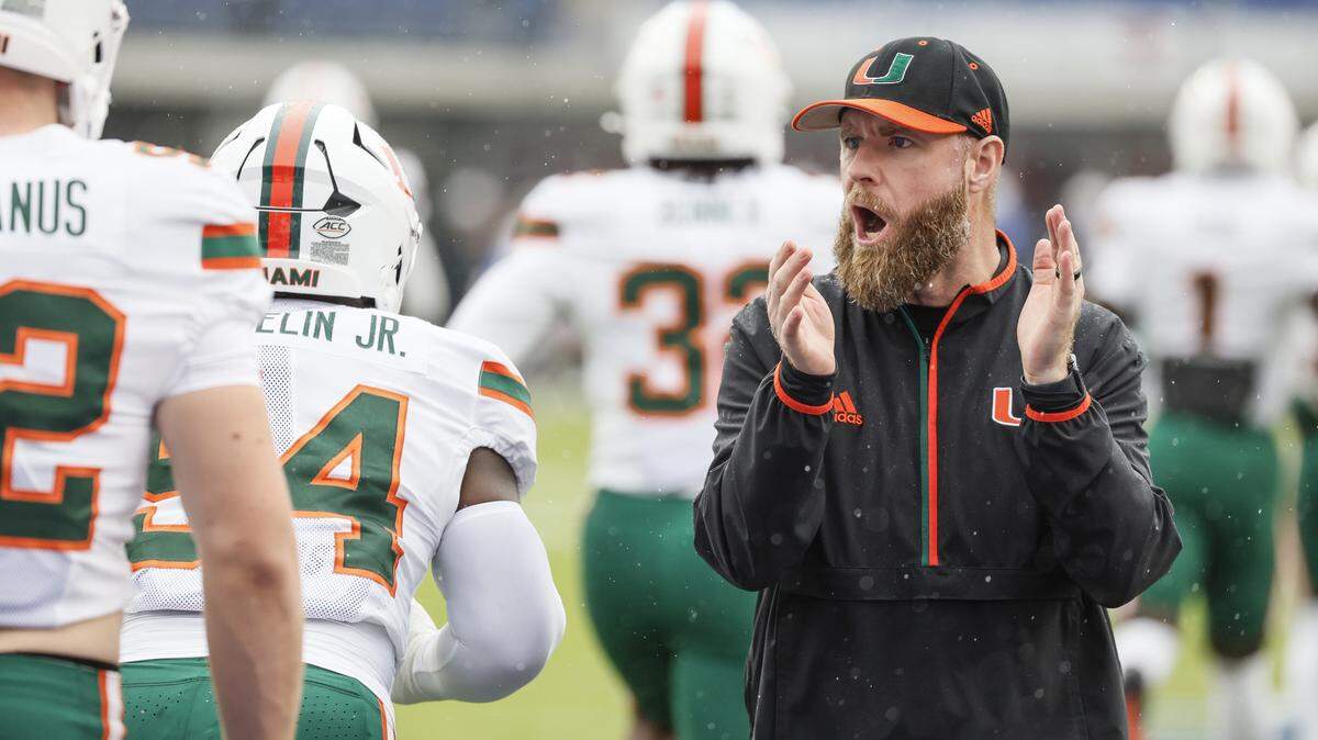 Miami Hurricanes Defensive Coordinator / Linebackers Coach Corey Hetherman works with players before the start of an NCAA football game against Southern Methodist University Mustangs at Gerald Ford Stadium on Saturday, November 1, 2025, in Dallas, Texas.