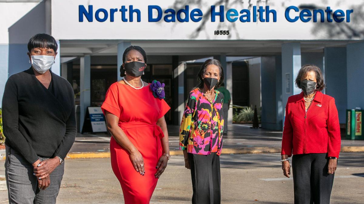 To boost vaccination rates in Black residents, Jackson Health hospital system has partnered with Black sororities and service organizations. Four of the leaders of that effort posed in front of a Jackson facility, the North Dade Health Center in Miami Gardens, on Friday, Feb. 5, 2021. From left: Audrey M. Edmonson, a former Miami-Dade commissioner; Stephanie Steele-Nelson, president of the Miami Alumnae Chapter of Delta Sigma Theta; Sandy Sears, who is active in Delta Sigma Theta and the Links service organization; and Georgia McClean, president of the Miami-Biscayne Bay chapter of the Links Inc.