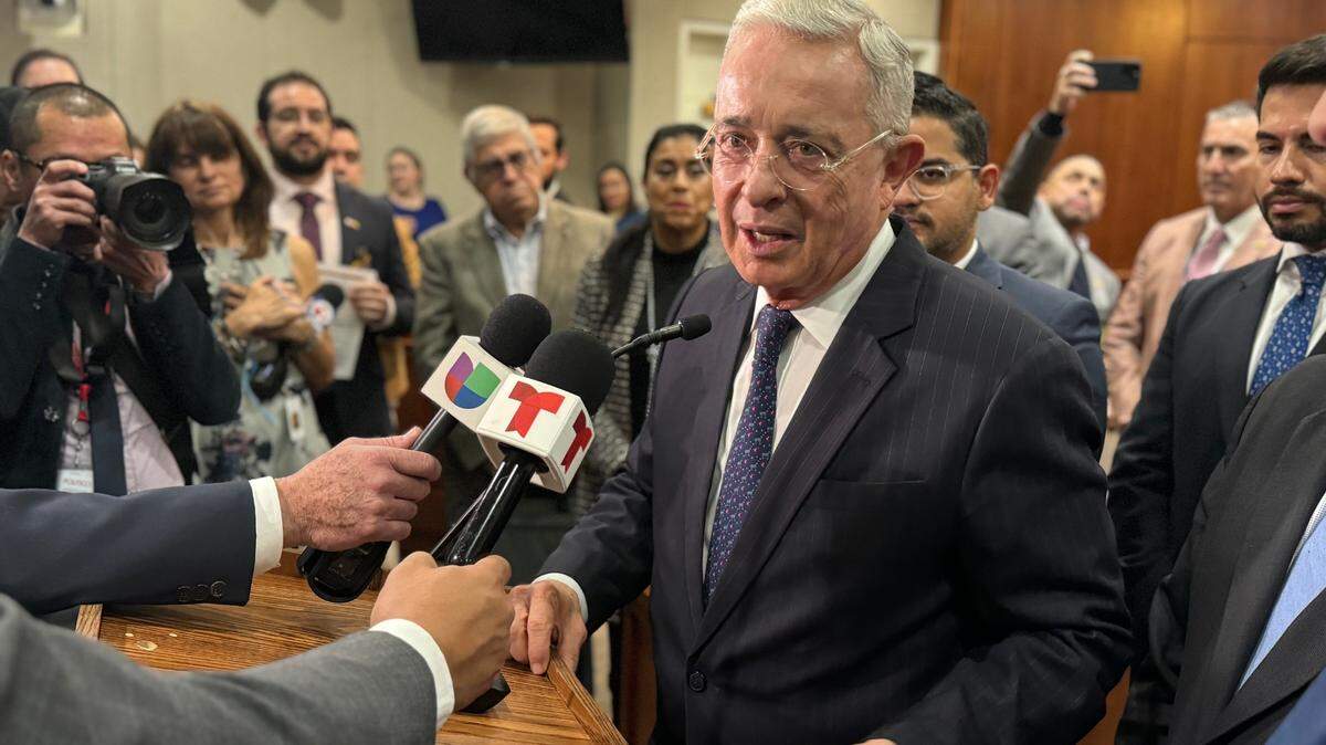 Former Colombian President Álvaro Uribe Vélez speaks to reporters in Tallahassee on Jan. 10, 2024.