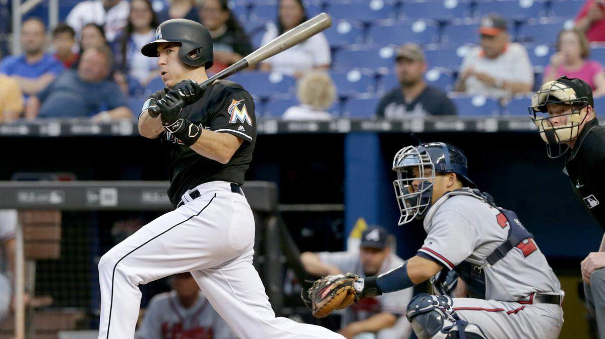 Marlins catcher J.T. Realmuto hits a double in the first inning of the Miami Marlins vs Atlanta Braves game at Marlins Park, Friday, May 11, 2018.