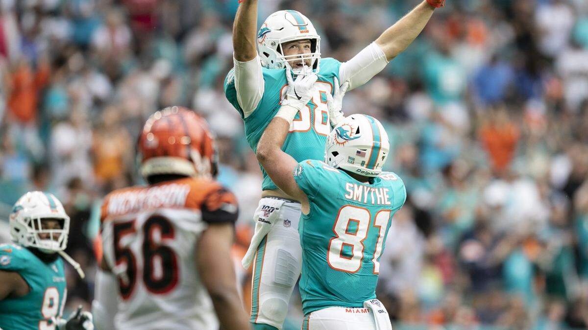 Miami Dolphins tight end Mike Gesicki (88) and tight end Durham Smythe (81) celebrate Gesicki’s second quarter touchdown as the Miami Dolphins host the Cincinnati Bengals at Hard Rock Stadium in Miami Gardens on Sunday, December 22, 2019.