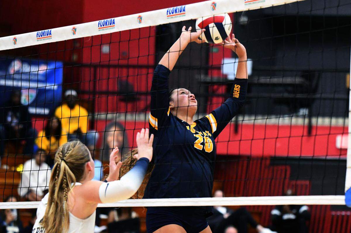 St. Thomas Aquinas senior setter Mikayla Porter sets up a shot against Gulf Breeze during the Class 6A girls volleyball state championship game on Saturday at Polk State College in Winter Haven, Fla.