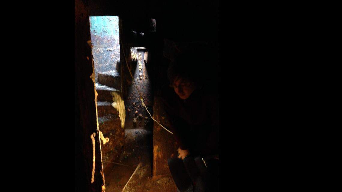 The spiraling staircase, which is now corroded, leads to an underground bunker.