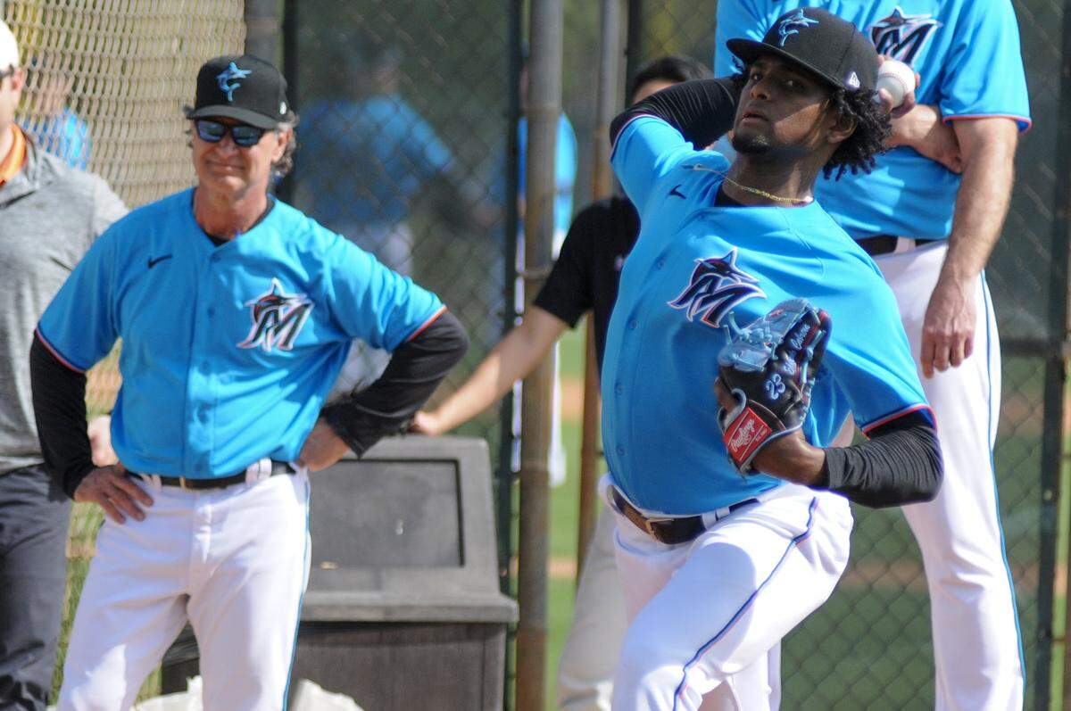 Miami Marlins pitcher Edward Cabrera&nbsp;throws a bullpen session while manager Don Mattingly looks on during spring training on Friday, Feb. 14, 2020, at the Roger Dean Chevrolet Stadium complex in Jupiter, Florida.