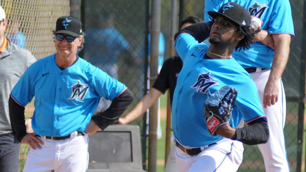Miami Marlins pitcher Edward Cabrera throws a bullpen session while manager Don Mattingly looks on during spring training on Friday, Feb. 14, 2020, at the Roger Dean Chevrolet Stadium complex in Jupiter, Florida.