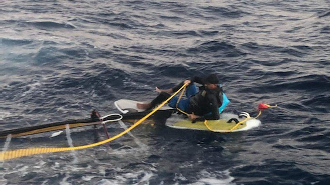 Elián López Cabrera sits stranded on a windsurf board about 15 miles off the Florida Keys Wednesday, March 23, 2022. Federal authorities say he is a Cuban citizen attempting to migrate to the United States.