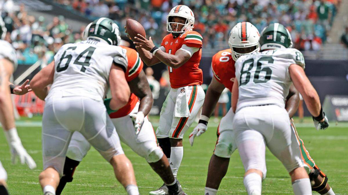 Miami Hurricanes offensive lineman Navaughn Donaldson (55) and Zion Nelson (60) protect Hurricanes quarterback D’Eriq King (1) during the second quarter of their ACC football game against the Michigan State Spartans at Hard Rock Stadium on Saturday, September 18, 2021 in Miami Gardens, Florida.
