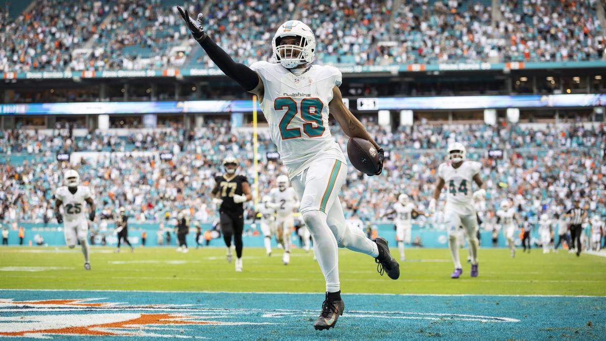 Miami Dolphins safety Minkah Fitzpatrick (29) reacts after intercepting the ball and running back a two point conversion against the New Orleans Saints in the second half of their NFL game at Hard Rock Stadium on Sunday, Nov. 30, 2025, in Miami Gardens, Fla.