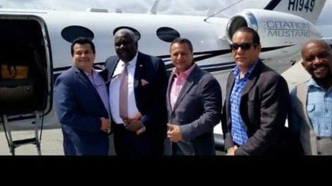 Haitian-American pastor and politician Christian Emmanuel Sanon, second from left, stands between Arcángel Pretel Ortiz, on his left, and Antonio ‘Tony’ Intriago, on his right, along with two unidentified men in front of an airplane prior to the July 7, 2021 assassination of Haiti’s president.