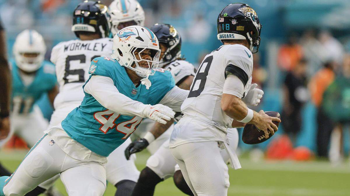 Miami Dolphins linebacker Chop Robinson (44) sacks Jacksonville Jaguars quarterback John Wolford (18) in the first half during an NFL football game at Hard Rock Stadium in Miami Gardens, Florida, on Saturday, August 23, 2025. 

