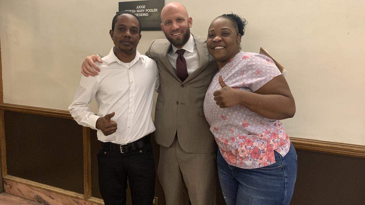 Pete Campbell, left, Miami lawyer Jonathan Jordan and Sashina Richards, Campbell’s wife, smile in court after a judge dismissed a murder charge against Campbell.