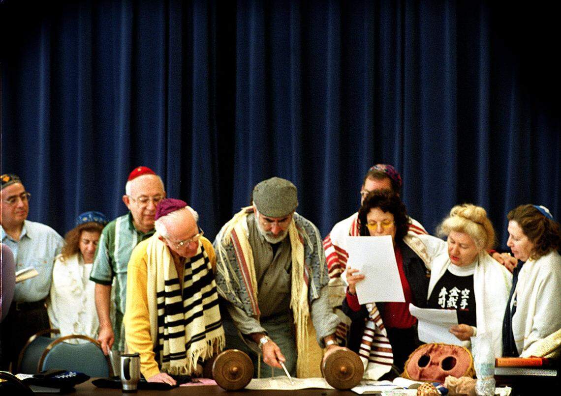 Rabbi Mitchell Chefitz, prominent South Florida rabbi, author and teacher, passed away earlier this week at the age of 84. He’s photographed here in 2001, reading The Torah for a small group at the Hillel Jewish Student Center, University of Miami.