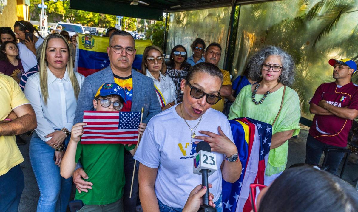 Venezuelan-American activist Adelys Ferro talks to the press during a vigil held in Doral by the Venezuelan American Caucus in support of the extension of the TPS for Venezuelans, on May 08, 2025.