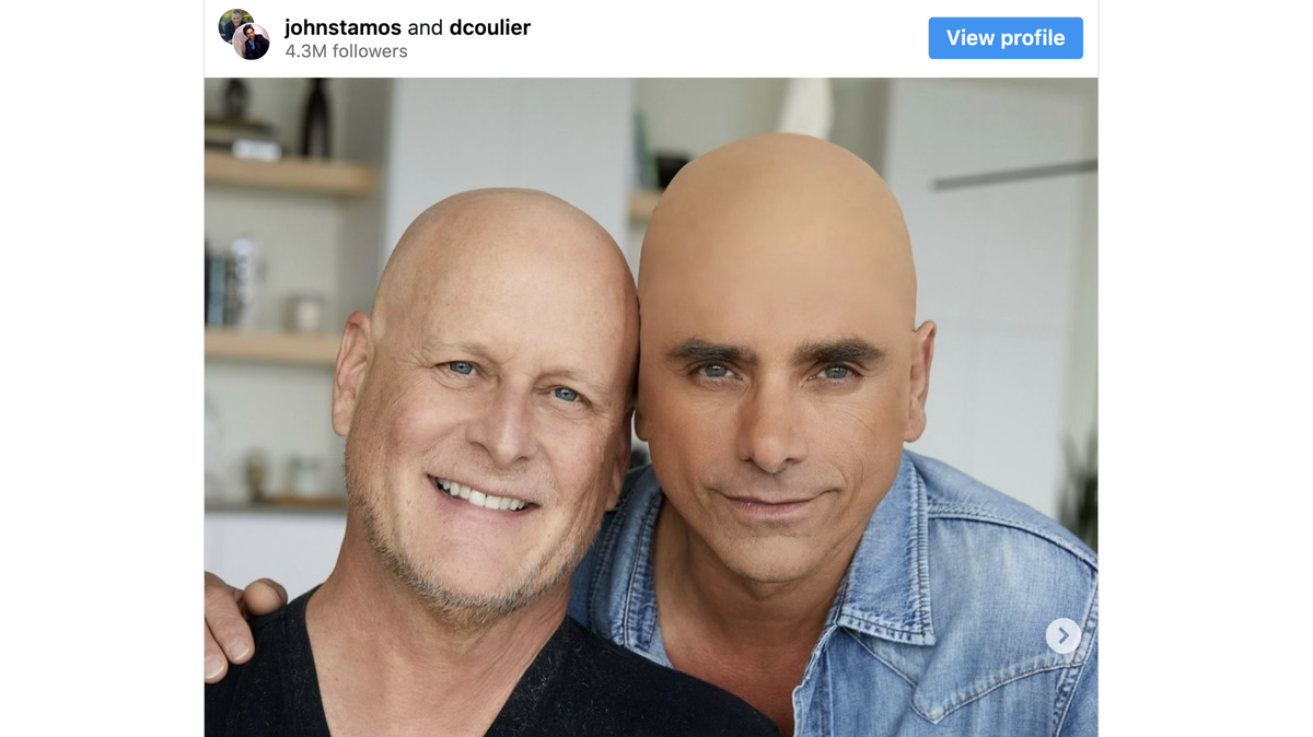 John Stamos and Dave Coulier pose together.