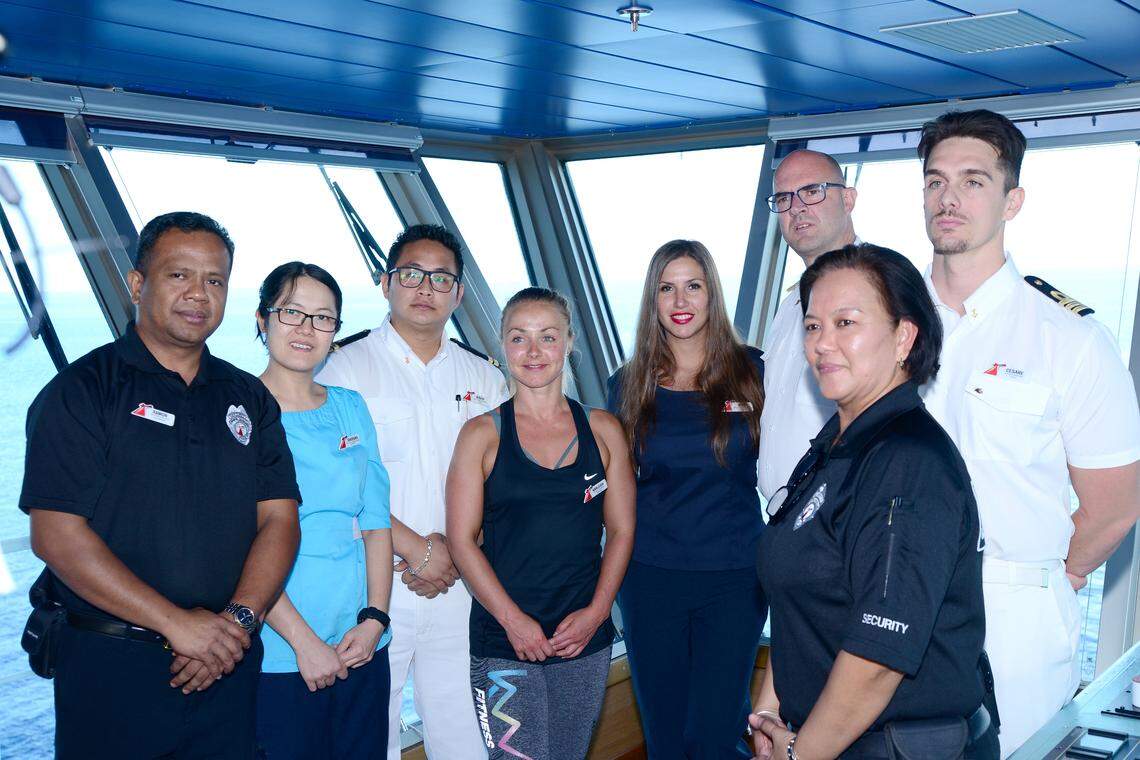 Crew members on Carnival Glory who played a role in the rescue at sea on Sunday of a Norwegian Cruise Line crew member. From left to right: Securitay Guard Ramon Morales; Assistant Stateroom Steward Ni Puti Kharisma Dew Wiryanari; Assitance Chief Security Rishu Thapa; Playlist Dancer Karleigh Wright; Assistant Shore Excursion Manager Maja Krstic; Captain Pero Grubješić; Safety Officer Cesare Mattera and Security Guard Irma Caldino Mariscotes.