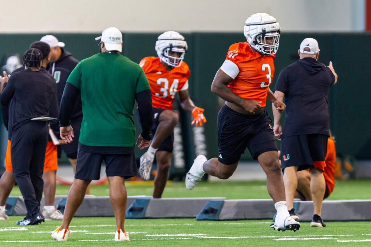 Miami Hurricanes defensive lineman Akheem Mesidor (3) runs during practice at the Carol Soffer Indoor Practice Facility on Wednesday, July 31, 2024, in Coral Gables, Fla.