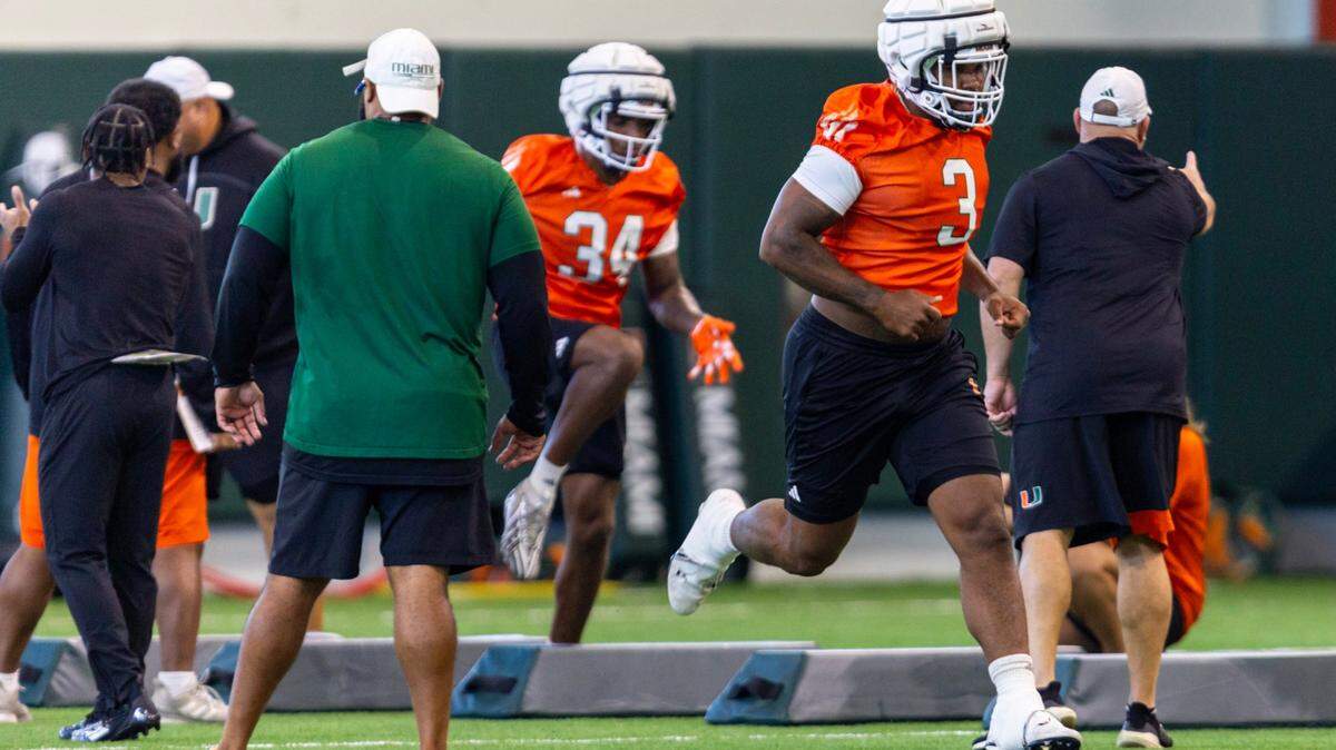 Miami Hurricanes defensive lineman Akheem Mesidor (3) runs during practice at the Carol Soffer Indoor Practice Facility on Wednesday, July 31, 2024, in Coral Gables, Fla.