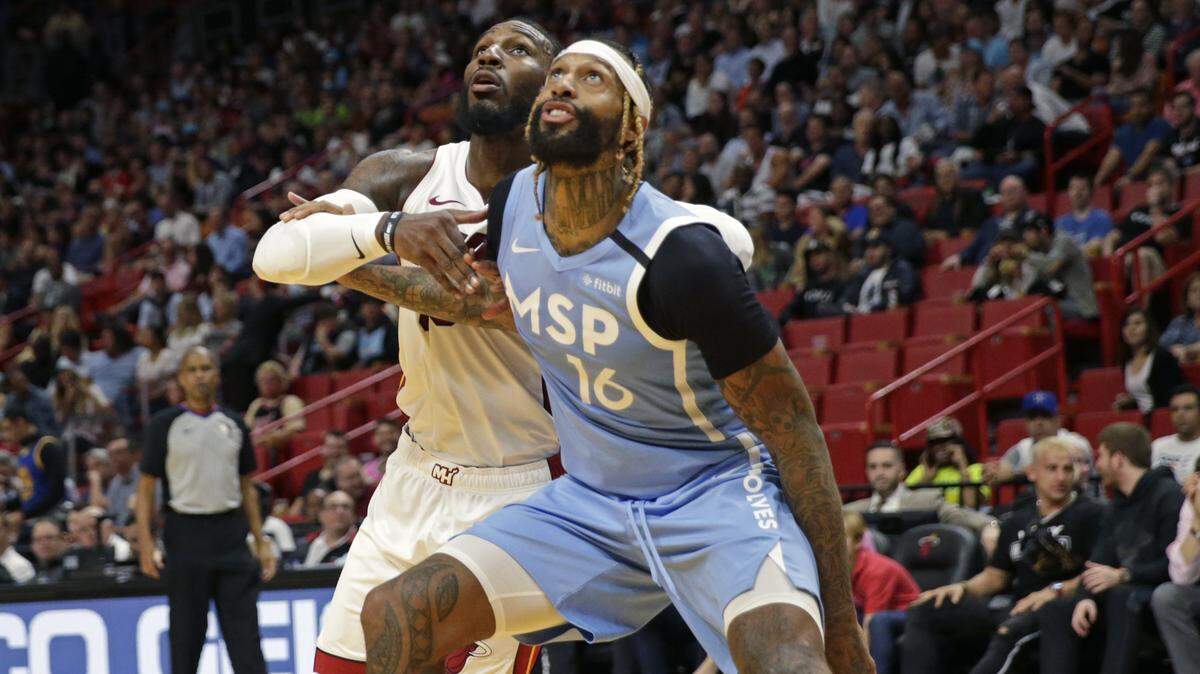 Miami Heat forward Jae Crowder (99) fight for position under the basket against Minnesota Timberwolves forward James Johnson (16) in the second quarter of an NBA basketball regular season game at the AmericanAirlines Arena on Wednesday, February 26, 2020.
