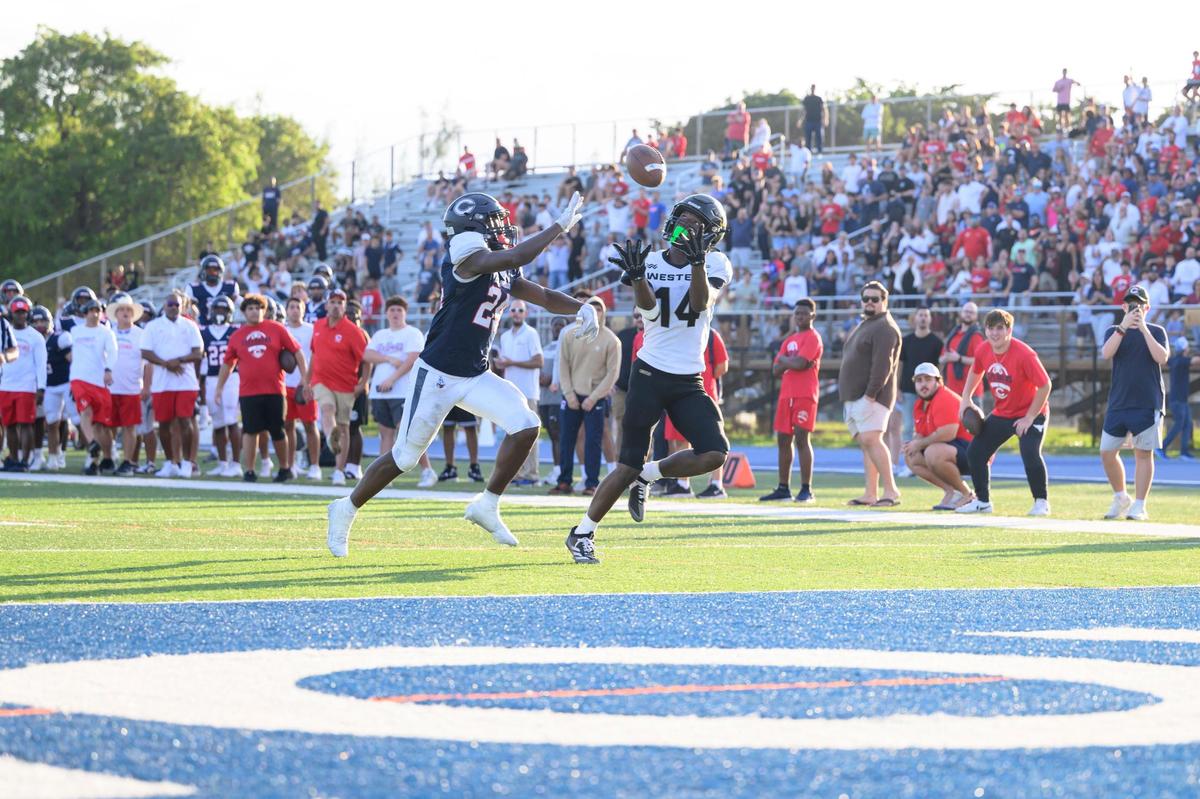 Western High School wide receiver Khamarian Young (14) scores a touchdown during the game at Tropical Park on Friday, Nov. 29, 2024 in Miami, Fla. (Ruben Gonzalez/Miami Herald)
