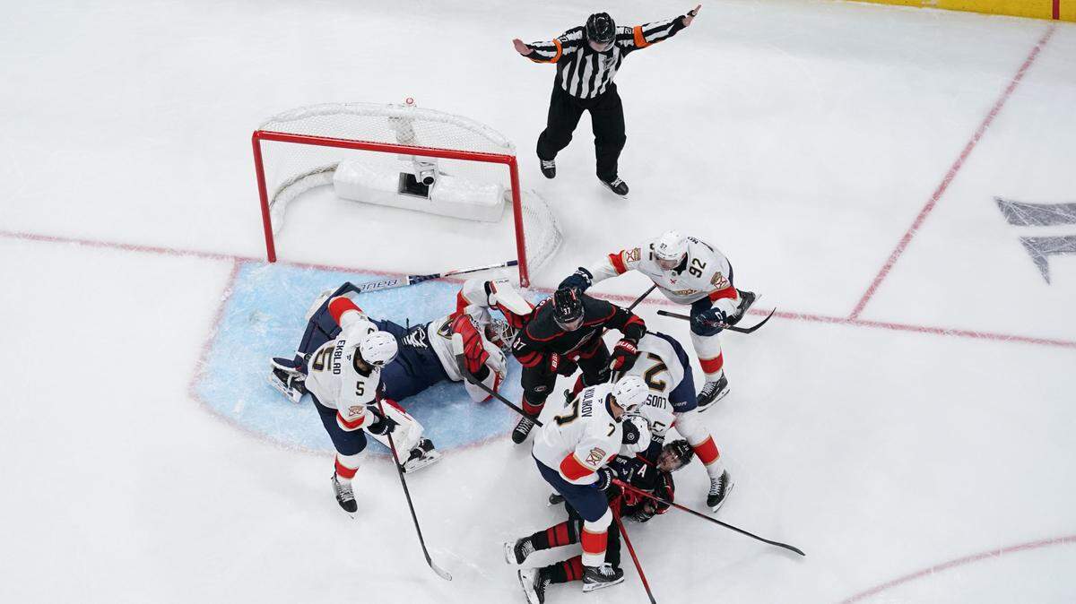 May 20, 2025; Raleigh, North Carolina, USA; Florida Panthers goaltender Sergei Bobrovsky (72) and defenseman Aaron Ekblad (5) and forward Tomas Nosek (92) and forward Eetu Luostarinen (27) and defenseman Dmitry Kulikov (7) defend against Carolina Hurricanes during the second period in game one of the Eastern Conference Final of the 2025 Stanley Cup Playoffs at Lenovo Center. Mandatory Credit: James Guillory-Imagn Images