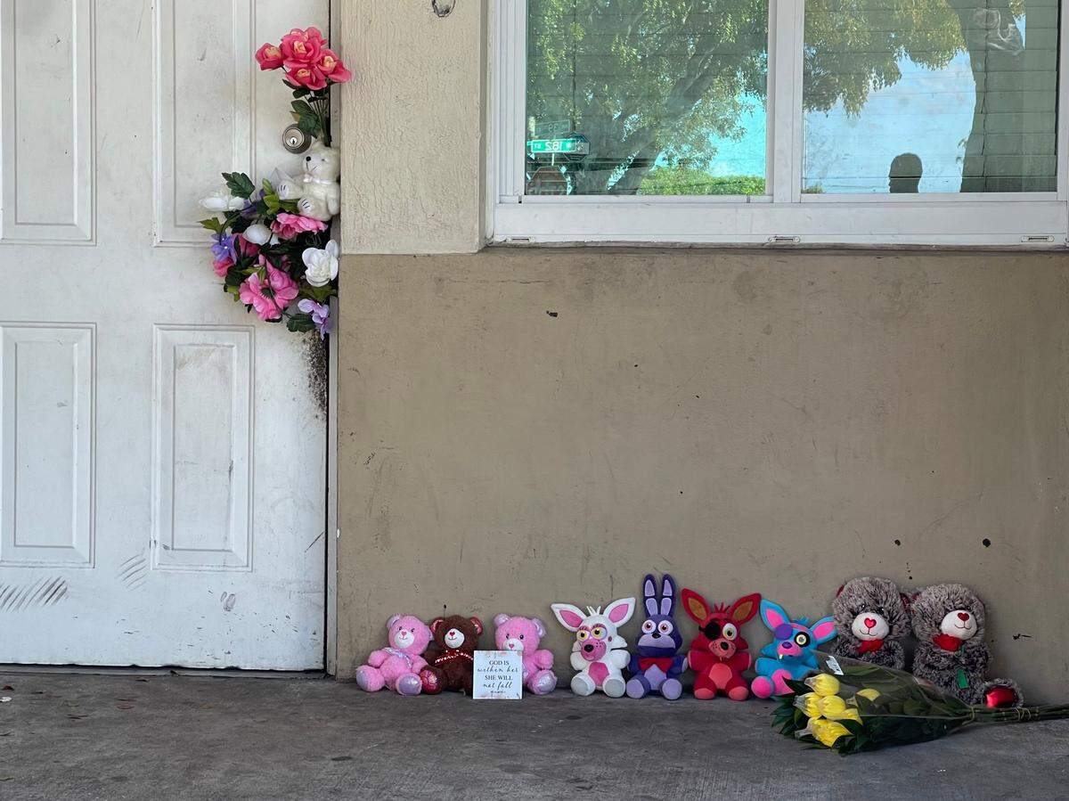 The family’s door was adorned with flowers and stuffed animals in memorial of the deceased children and their grandmother.
