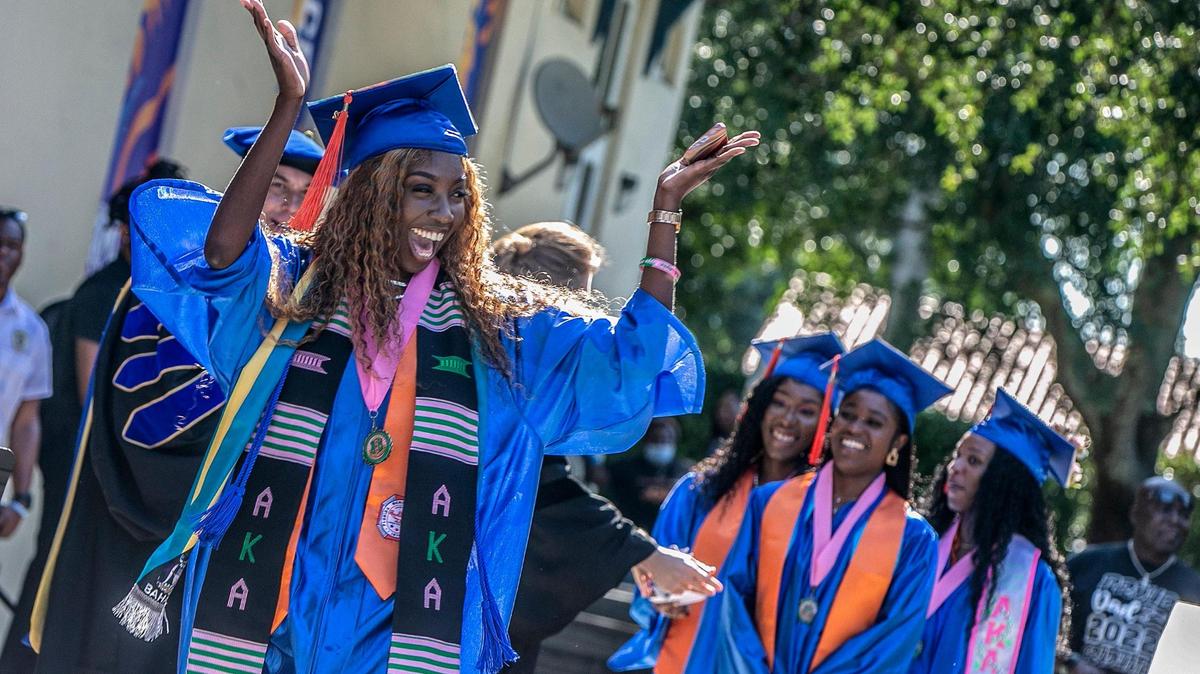 Student Creanne Alicia Butler, reacts as she graduates with a Bachelor of Science in Aeronautical Science, during the Spring 2022 Commencement ceremony at Florida Memorial University in Miami Gardens, on Saturday May 14, 2022.