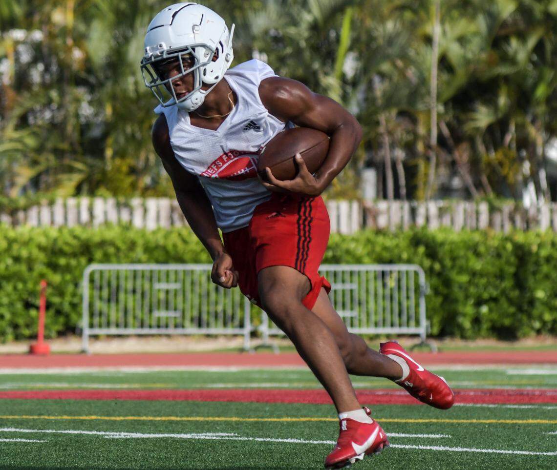 Cardinal Gibbons running back Kamari Moulton carries the ball during practice on Monday, Aug. 1, 2022, at Cardinal Gibbons High in Fort Lauderdale, Florida.
