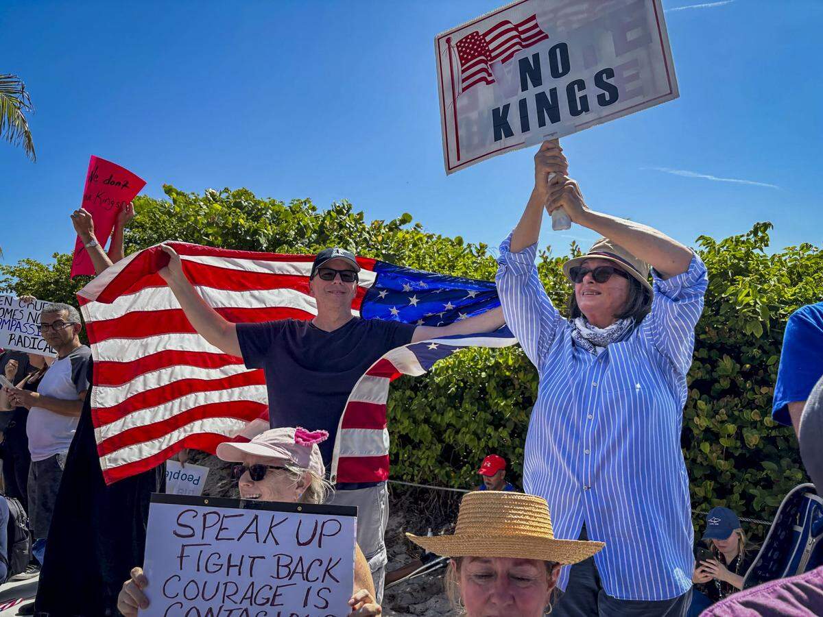People protest along A1A in Fort Lauderdale Beach during the No Kings protests in June.