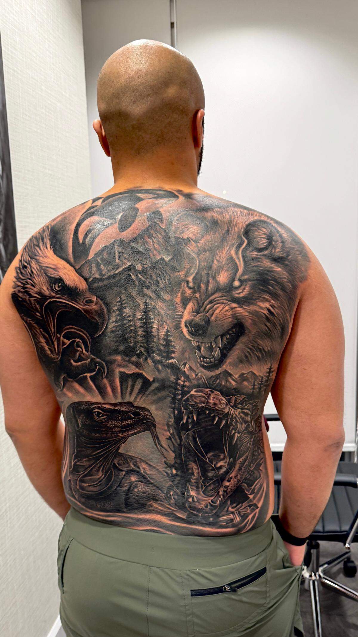 Dom Groenveld showing off his completed back tattoo.