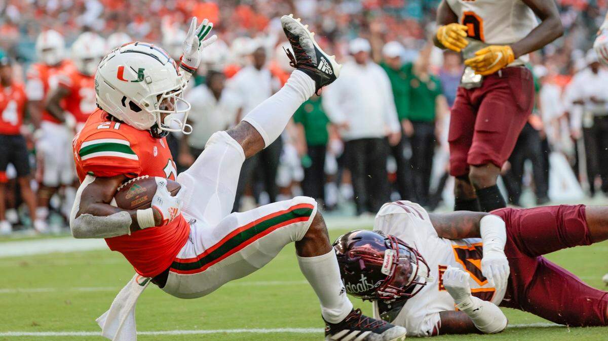 Miami Hurricanes running back Henry Parrish Jr. (21) scores in the second quarter against the Bethune Cookman Wildcats at Hard Rock Stadium in Miami Gardens on Saturday, September 3, 2022.